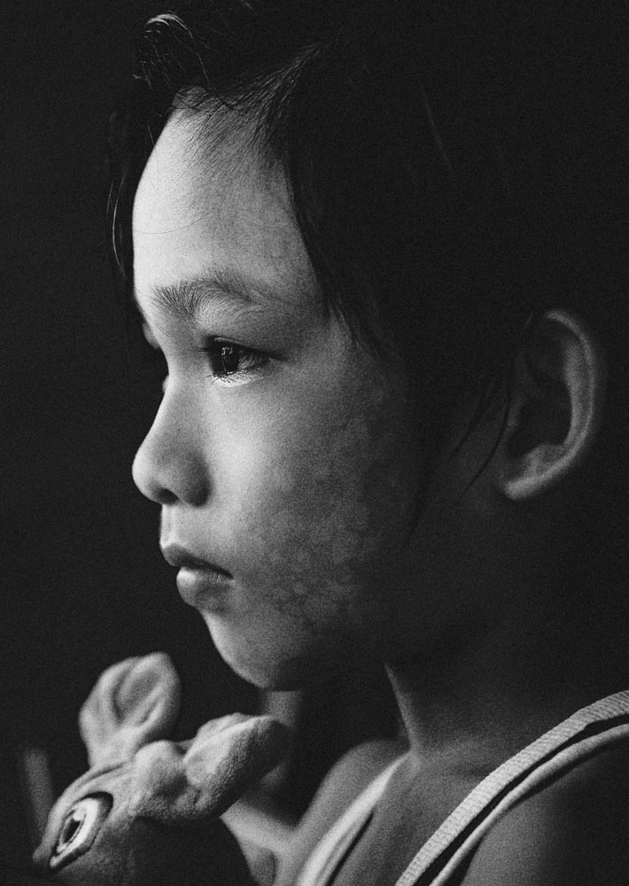 a person standing in front of a rock formation