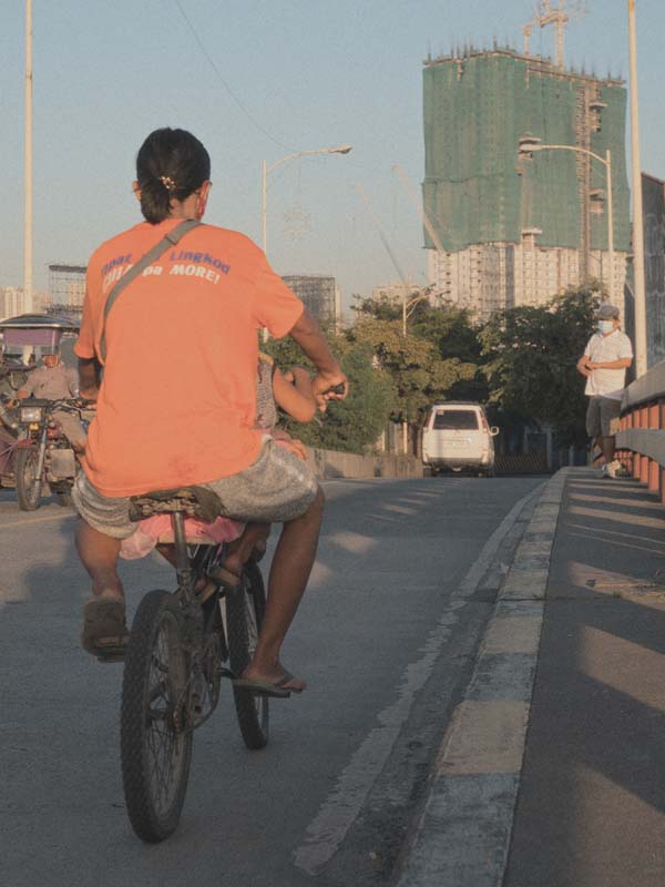 a person standing in front of a rock formation