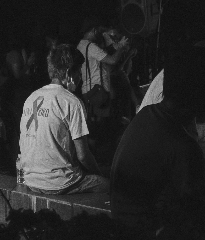 a person standing in front of a rock formation