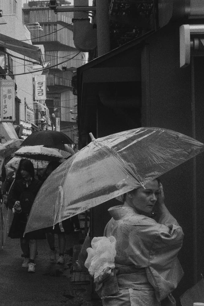 a person standing in front of a rock formation