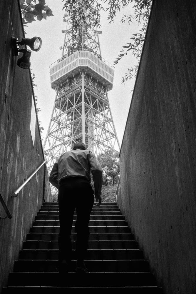 a person standing in front of a rock formation