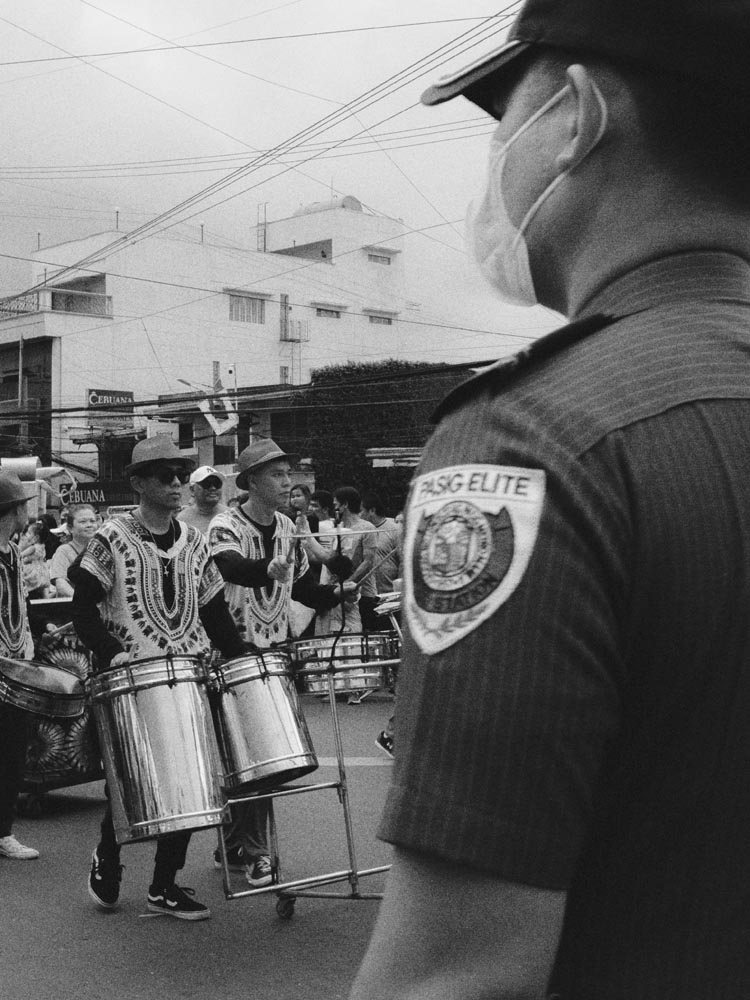 a person standing in front of a rock formation