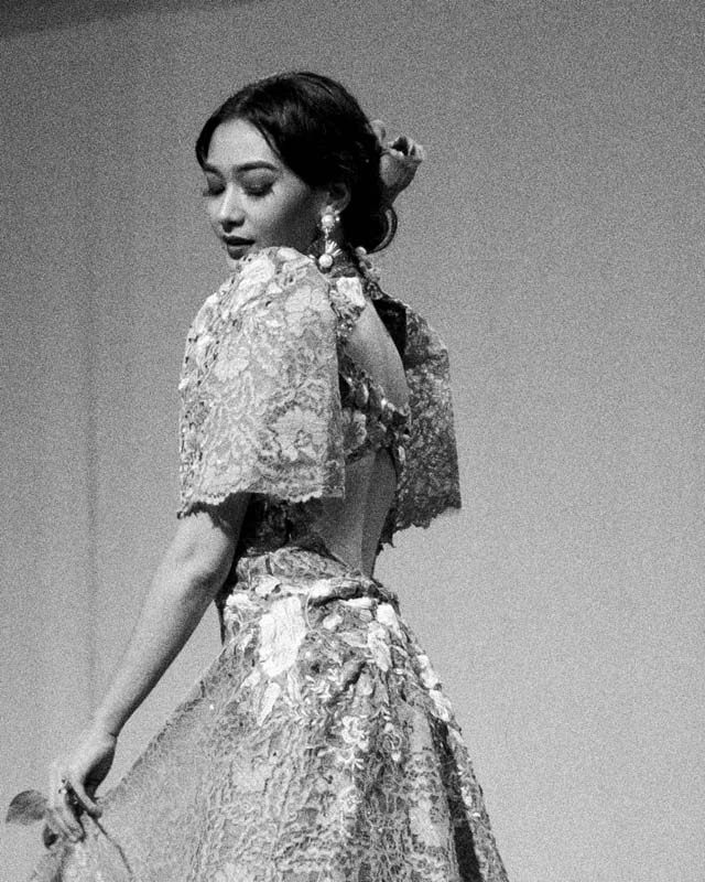 a person standing in front of a rock formation