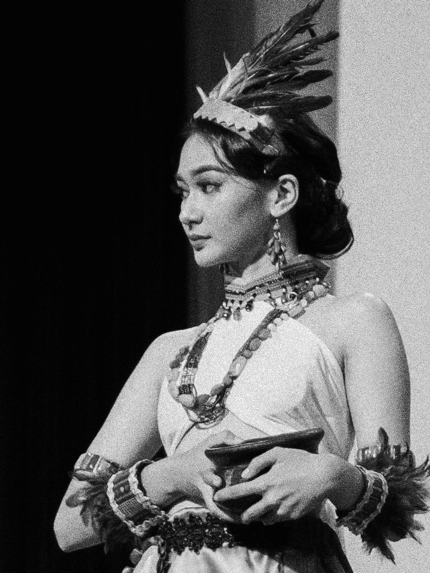 a person standing in front of a rock formation