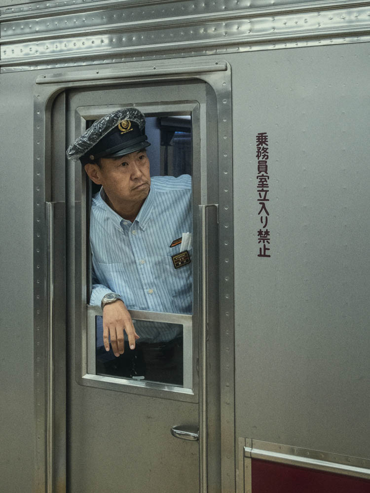 a person standing in front of a rock formation